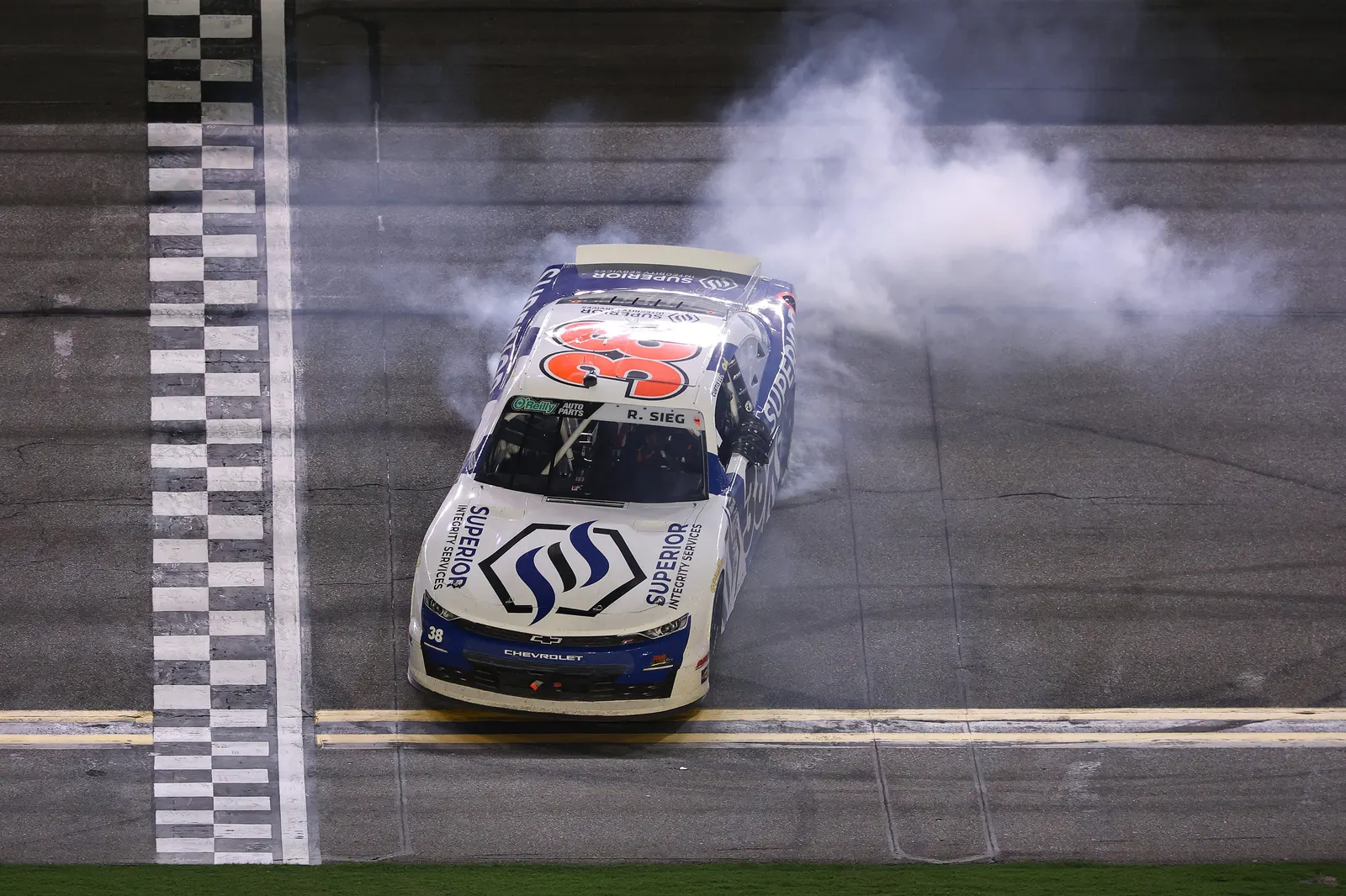 The Superior Integrity Services No. 38 doing a burnout after the win at Daytona.